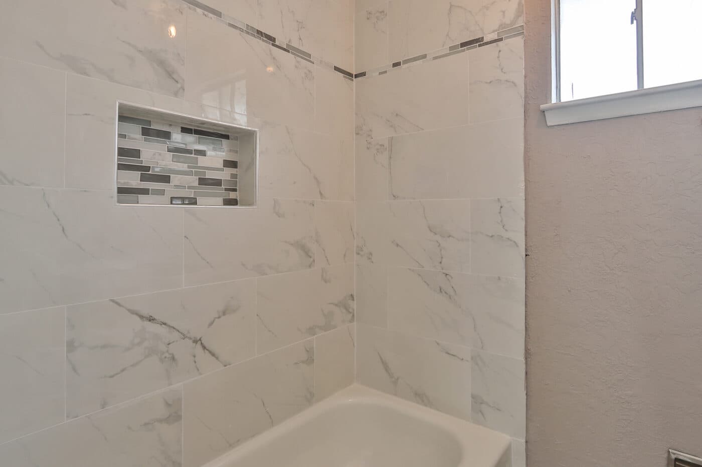 Bathroom shower tile detail by AJ Construction and Remodeling